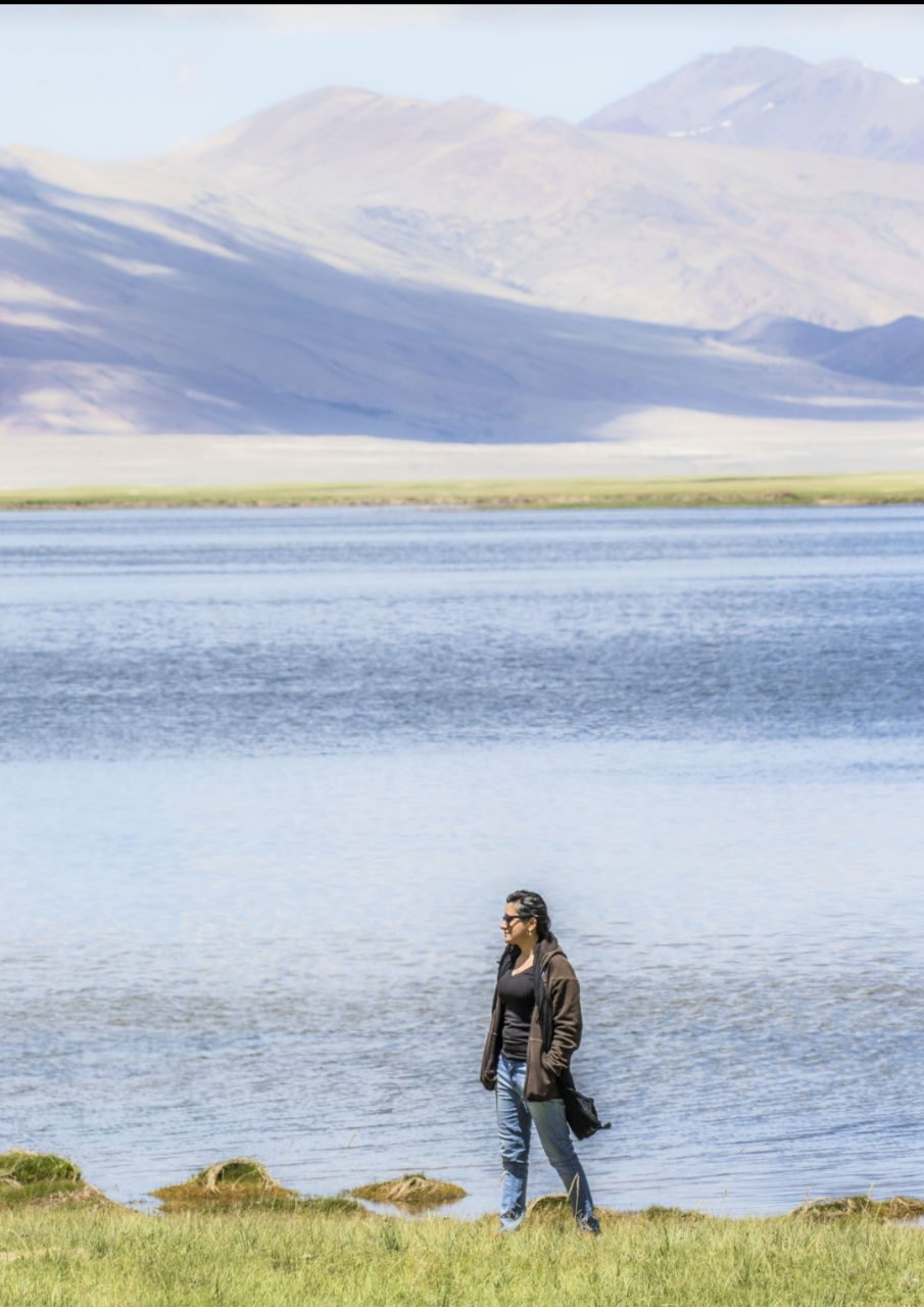 Preksha Sharma beside a lake in the Trans-Himalayas during the Indo-Swiss climate reporting fellowship, 2017